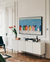 Kitschy Cabanas I by Phyllis Adams. shown as a framed stretched canvas in a living room above a console. Available as a archival giclee rolled canvas, fine art paper, or poster print. SKU 88628i.