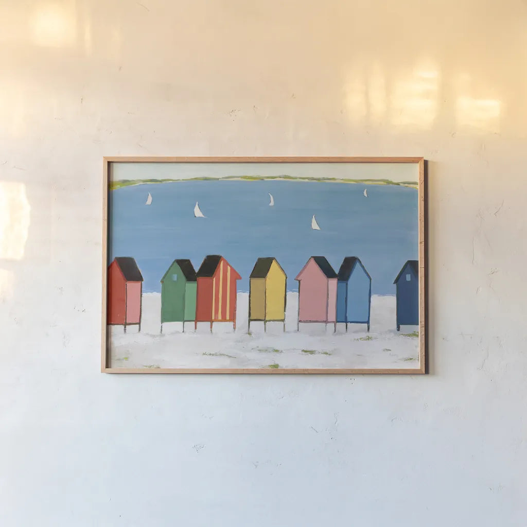 Kitschy Cabanas I by Phyllis Adams. shown as a paper print in a natural frame. Available as a archival giclee rolled canvas, fine art paper, or poster print. SKU 88628i.