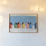 Kitschy Cabanas I by Phyllis Adams. shown as a paper print in a natural frame. Available as a archival giclee rolled canvas, fine art paper, or poster print. SKU 88628i.