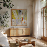 On the Sunnyside of the Street by Phyllis Adams. Shown in a natural wood frame in a cozy modern living room. Available as an archival giclee rolled canvas, fine art paper, or poster print. SKU 37286a.