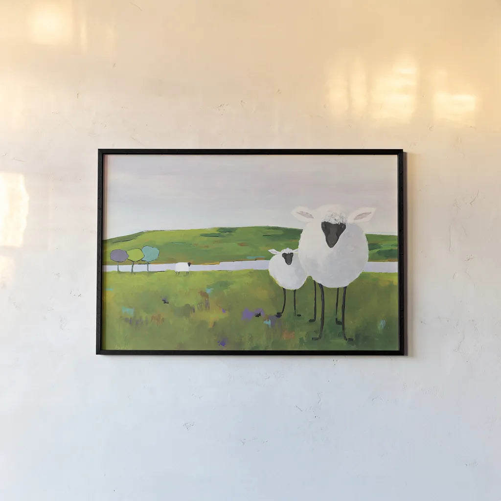 Sheep in the Meadow by Phyllis Adams. shown as a paper print in a black flame. Available as a archival giclee rolled canvas, fine art paper, or poster print. SKU 27254i.