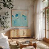 Splash by Phyllis Adams. Shown in a natural wood frame in a cozy modern living room. Available as an archival giclee rolled canvas, fine art paper, or poster print. SKU 27245a.