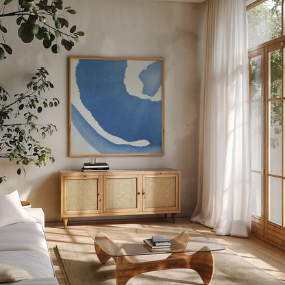 Batik Blue III by Piper Rhue. Shown in a natural wood frame in a cozy modern living room. Available as an archival giclee rolled canvas, fine art paper, or poster print. SKU 34419a.