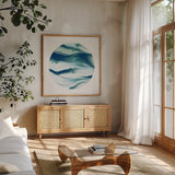 Dark Matter Blue II by Piper Rhue. Shown in a natural wood frame in a cozy modern living room. Available as an archival giclee rolled canvas, fine art paper, or poster print. SKU 53962a.