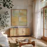 Gray Stone and Gold by Piper Rhue. Shown in a natural wood frame in a cozy modern living room. Available as an archival giclee rolled canvas, fine art paper, or poster print. SKU 47271a.