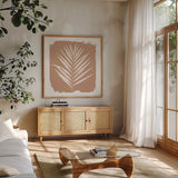 Nature by the Lake Frond III Sq Natural by Piper Rhue. Shown in a natural wood frame in a cozy modern living room. Available as an archival giclee rolled canvas, fine art paper, or poster print. SKU 71825a.