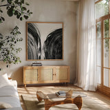 Swirl I BW by Piper Rhue. Shown in a natural wood frame in a cozy modern living room. Available as an archival giclee rolled canvas, fine art paper, or poster print. SKU 86081a.