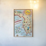 Vintage Florida Travel Map by Public Domain. shown as a paper print in a natural frame. Available as a archival giclee rolled canvas, fine art paper, or poster print. SKU 94632h.