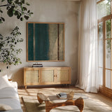 Bora Blue Square II by Roque Silva. Shown in a natural wood frame in a cozy modern living room. Available as an archival giclee rolled canvas, fine art paper, or poster print. SKU 42455a.