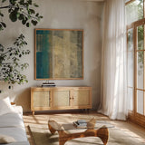 Kuna Blue Square I by Roque Silva. Shown in a natural wood frame in a cozy modern living room. Available as an archival giclee rolled canvas, fine art paper, or poster print. SKU 42451a.