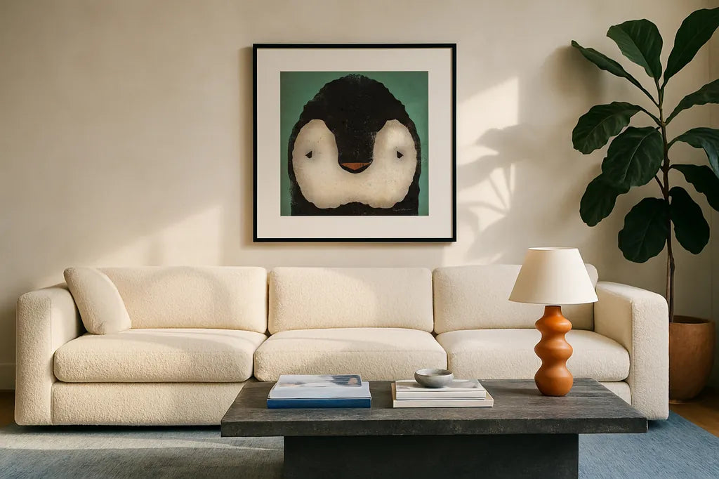 Baby Penguin by Ryan Fowler. Displayed in a glass frame with matte in a clean modern living room. Available as an archival giclee rolled canvas, fine art paper, or poster print. SKU 24548a.