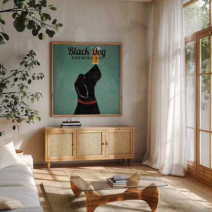 Black Dog Brewing Co Square by Ryan Fowler. Shown in a natural wood frame in a cozy modern living room. Available as an archival giclee rolled canvas, fine art paper, or poster print. SKU 9815a.