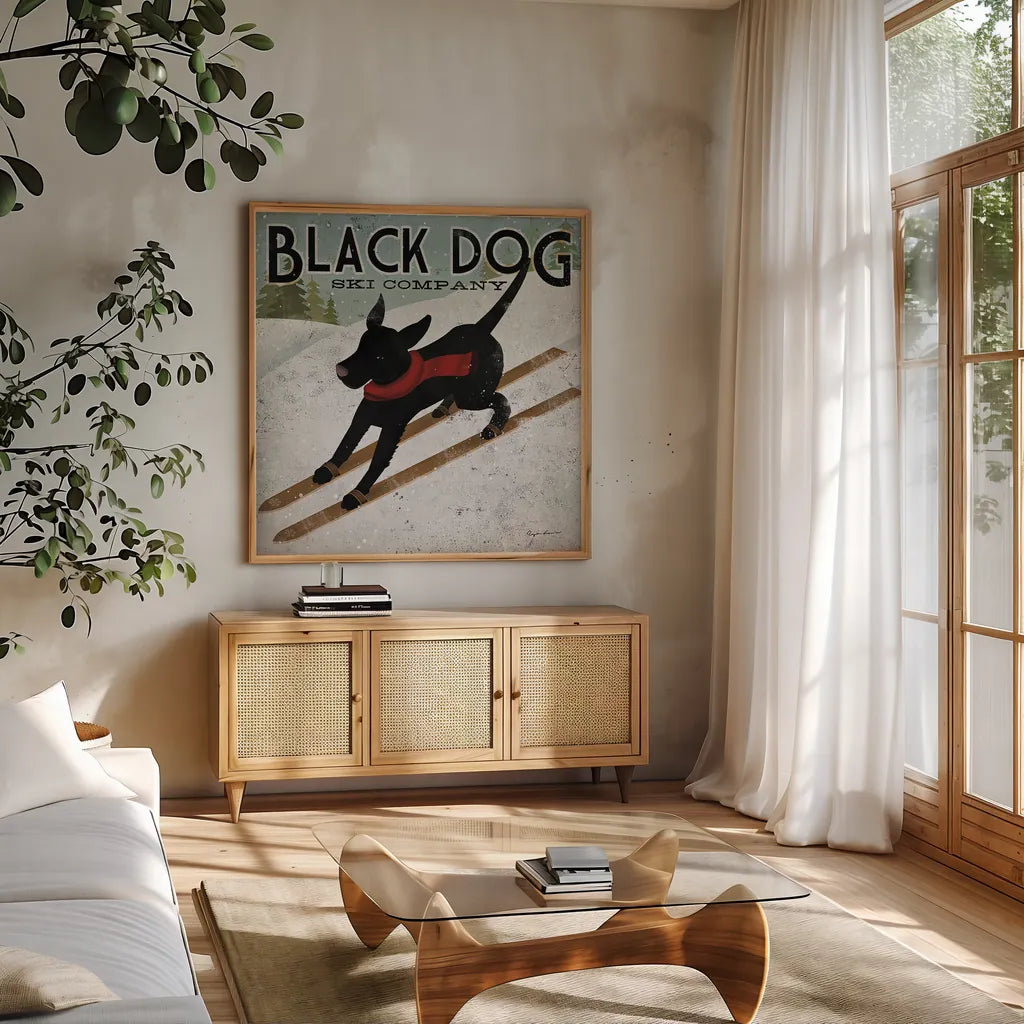 Black Dog Ski by Ryan Fowler. Shown in a natural wood frame in a cozy modern living room. Available as an archival giclee rolled canvas, fine art paper, or poster print. SKU 12502a.
