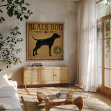 Black Dog at Show by Ryan Fowler. Shown in a natural wood frame in a cozy modern living room. Available as an archival giclee rolled canvas, fine art paper, or poster print. SKU 15016a.