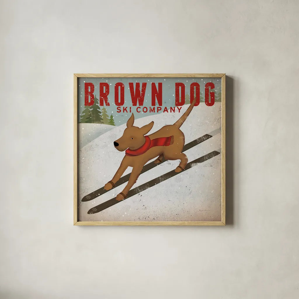 Brown Dog Ski Co by Ryan Fowler. Shown in a natural wood glass frame for a timeless modern aesthetic. Available as an archival giclee rolled canvas, fine art paper, or poster print. SKU 17199a.