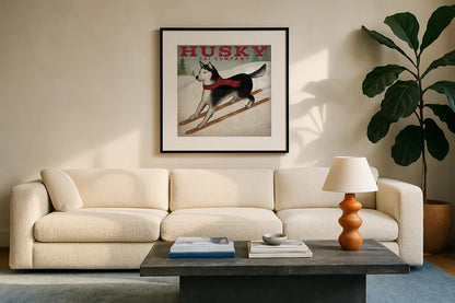 Husky Ski Co by Ryan Fowler. Displayed in a glass frame with matte in a clean modern living room. Available as an archival giclee rolled canvas, fine art paper, or poster print. SKU 15015a.