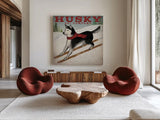Husky Ski Co by Ryan Fowler. Shown as extra-large giant wall art in a modern living room. Available as an archival giclee rolled canvas, fine art paper, or poster print. SKU 15015a.