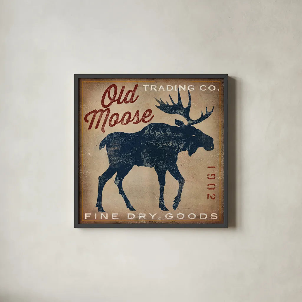 Old Moose Trading Co Tan - Dry Goods by Ryan Fowler. Shown in a sleek black glass frame for a contemporary gallery look. Available as an archival giclee rolled canvas, fine art paper, or poster print. SKU 35413a.