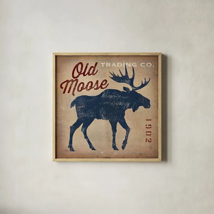 Old Moose Trading Co Tan by Ryan Fowler. Shown in a natural wood glass frame for a timeless modern aesthetic. Available as an archival giclee rolled canvas, fine art paper, or poster print. SKU 12858a.