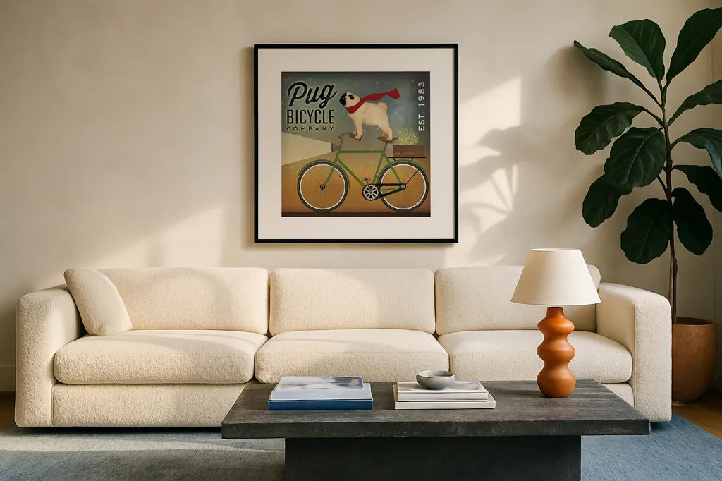 Pug on a Bike by Ryan Fowler. Displayed in a glass frame with matte in a clean modern living room. Available as an archival giclee rolled canvas, fine art paper, or poster print. SKU 17219a.