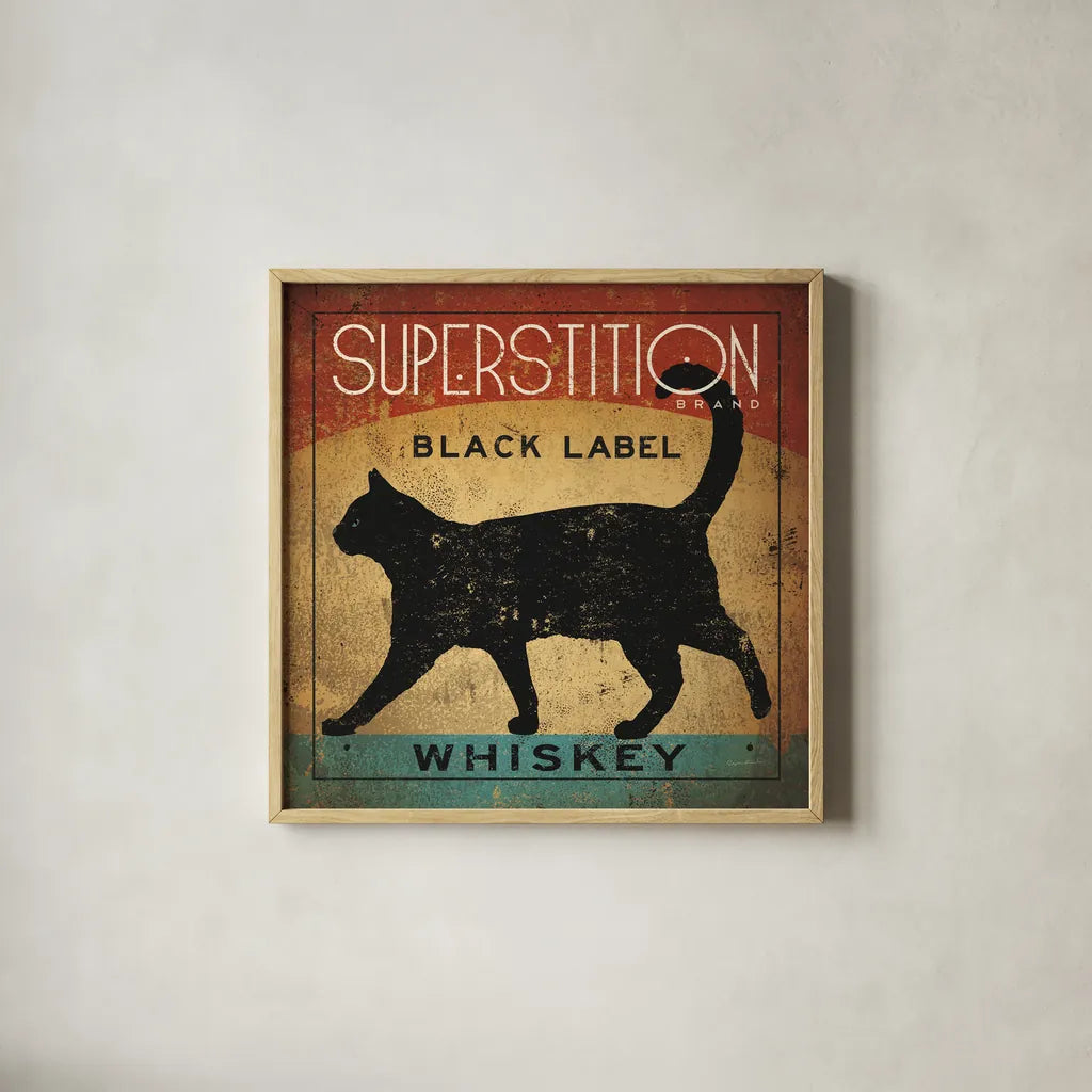 Superstition Black Label Whiskey Cat by Ryan Fowler. Shown in a natural wood glass frame for a timeless modern aesthetic. Available as an archival giclee rolled canvas, fine art paper, or poster print. SKU 28040a.