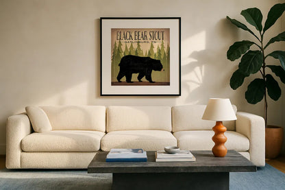 Take a Hike Bear Black Bear Stout by Ryan Fowler. Displayed in a glass frame with matte in a clean modern living room. Available as an archival giclee rolled canvas, fine art paper, or poster print. SKU 30841a.