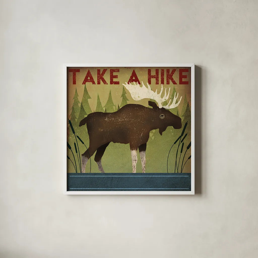 Take a Hike Moose by Ryan Fowler. Shown in a crisp white glass frame for a clean and minimalist style. Available as an archival giclee rolled canvas, fine art paper, or poster print. SKU 22892a.