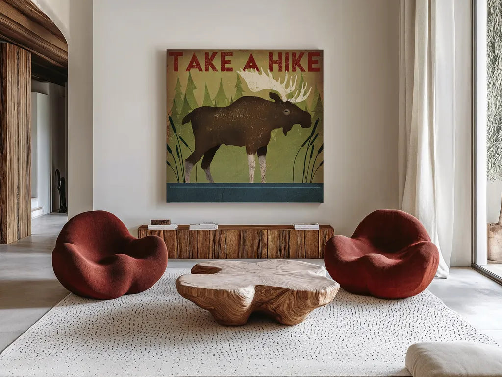 Take a Hike Moose by Ryan Fowler. Shown as extra-large giant wall art in a modern living room. Available as an archival giclee rolled canvas, fine art paper, or poster print. SKU 22892a.