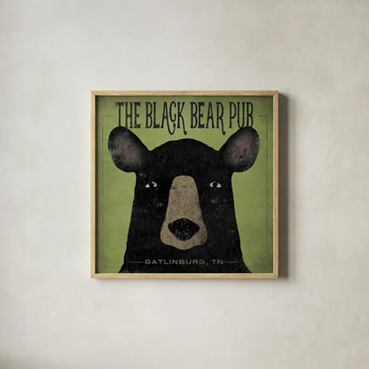 The Black Bear Pub by Ryan Fowler. Shown in a natural wood glass frame for a timeless modern aesthetic. Available as an archival giclee rolled canvas, fine art paper, or poster print. SKU 30842a.