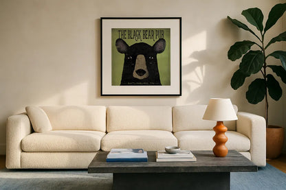 The Black Bear Pub by Ryan Fowler. Displayed in a glass frame with matte in a clean modern living room. Available as an archival giclee rolled canvas, fine art paper, or poster print. SKU 30842a.