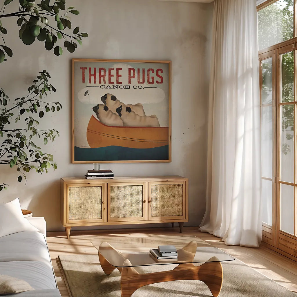 Three Pugs in a Canoe v3 by Ryan Fowler. Shown in a natural wood frame in a cozy modern living room. Available as an archival giclee rolled canvas, fine art paper, or poster print. SKU 13367a.