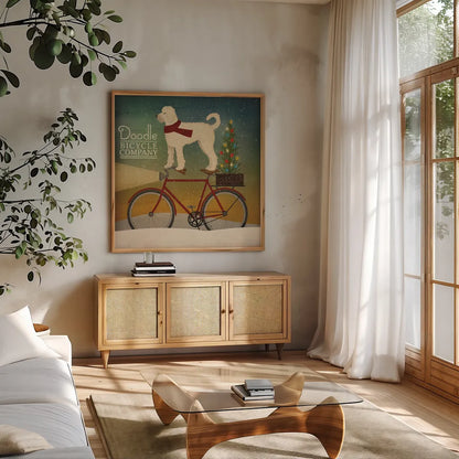 White Doodle on Bike Christmas by Ryan Fowler. Shown in a natural wood frame in a cozy modern living room. Available as an archival giclee rolled canvas, fine art paper, or poster print. SKU 31275a.