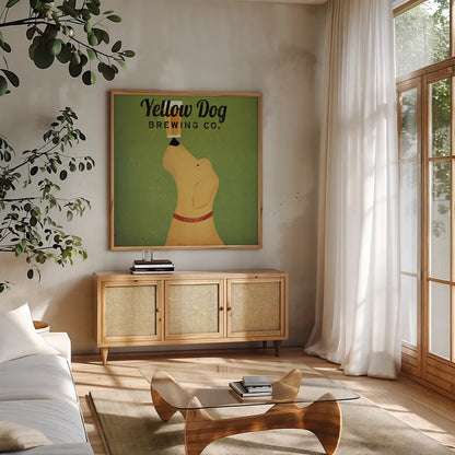 Yellow Dog Brewing Co Square by Ryan Fowler. Shown in a natural wood frame in a cozy modern living room. Available as an archival giclee rolled canvas, fine art paper, or poster print. SKU 9816a.