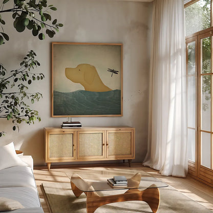 Yellow Dog Swim by Ryan Fowler. Shown in a natural wood frame in a cozy modern living room. Available as an archival giclee rolled canvas, fine art paper, or poster print. SKU 29763a.