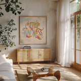 Cultivate Kindness by Sara Zieve Miller. Shown in a natural wood frame in a cozy modern living room. Available as an archival giclee rolled canvas, fine art paper, or poster print. SKU 58211a.