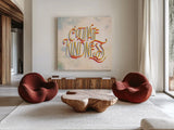 Cultivate Kindness by Sara Zieve Miller. Shown as extra-large giant wall art in a modern living room. Available as an archival giclee rolled canvas, fine art paper, or poster print. SKU 58211a.