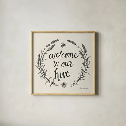 Happy to Bee Home II Words Neutral by Sara Zieve Miller. Shown in a natural wood glass frame for a timeless modern aesthetic. Available as an archival giclee rolled canvas, fine art paper, or poster print. SKU 54684a.