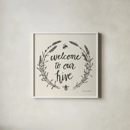 Happy to Bee Home II Words Neutral by Sara Zieve Miller. Shown in a crisp white glass frame for a clean and minimalist style. Available as an archival giclee rolled canvas, fine art paper, or poster print. SKU 54684a.