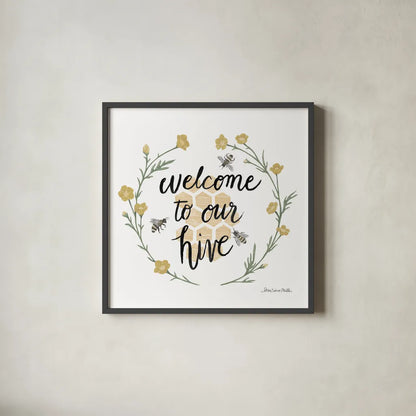 Happy to Bee Home III Welcome by Sara Zieve Miller. Shown in a sleek black glass frame for a contemporary gallery look. Available as an archival giclee rolled canvas, fine art paper, or poster print. SKU 44544a.