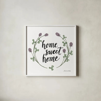 Happy to Bee Home Words I by Sara Zieve Miller. Shown in a crisp white glass frame for a clean and minimalist style. Available as an archival giclee rolled canvas, fine art paper, or poster print. SKU 33594a.