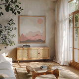 Mountainous I Pink by Sara Zieve Miller. Shown in a natural wood frame in a cozy modern living room. Available as an archival giclee rolled canvas, fine art paper, or poster print. SKU 67070a.