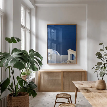 Santorini II by Sara Zieve Miller. shown as a print in a natural wood frame in a dining room. Available as a archival giclee rolled canvas, fine art paper, or poster print. SKU 32112h.