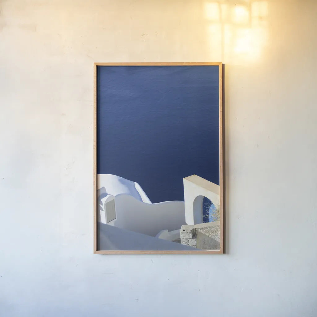 Santorini II by Sara Zieve Miller. shown as a paper print in a natural frame. Available as a archival giclee rolled canvas, fine art paper, or poster print. SKU 32112h.
