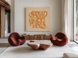 Spread Good Vibes by Sara Zieve Miller. Shown as extra-large giant wall art in a modern living room. Available as an archival giclee rolled canvas, fine art paper, or poster print. SKU 58296a.