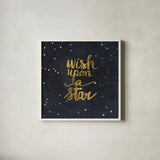 Starry Words Gold - Wish Upon A Star by Sara Zieve Miller. Shown in a crisp white glass frame for a clean and minimalist style. Available as an archival giclee rolled canvas, fine art paper, or poster print. SKU 36005a.