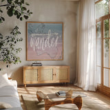 World Traveler Wander by Sara Zieve Miller. Shown in a natural wood frame in a cozy modern living room. Available as an archival giclee rolled canvas, fine art paper, or poster print. SKU 27424a.