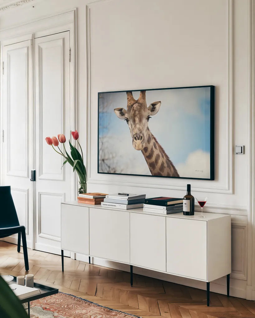 Giraffe Portrait I by Sharon Vardy. shown as a framed stretched canvas in a living room above a console. Available as a archival giclee rolled canvas, fine art paper, or poster print. SKU 91959i.