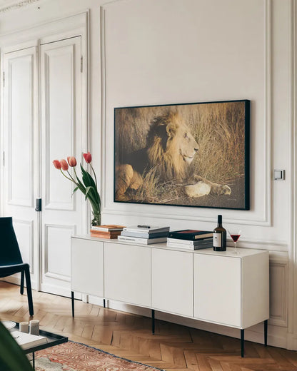 Golden Old Lion by Sharon Vardy. shown as a framed stretched canvas in a living room above a console. Available as a archival giclee rolled canvas, fine art paper, or poster print. SKU 92666i.