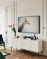 Head in the Clouds by Sharon Vardy. shown as a framed stretched canvas in a living room above a console. Available as a archival giclee rolled canvas, fine art paper, or poster print. SKU 92662i.