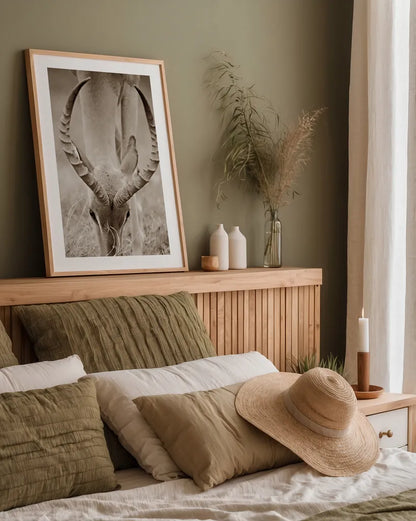 Impala Horns by Sharon Vardy. shown as a paper print in a natural frame. Available as a archival giclee rolled canvas, fine art paper, or poster print. SKU 92675h.